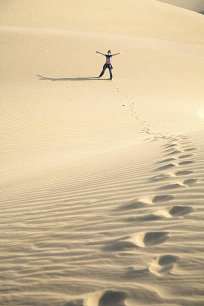 istock woman at the sand 96680543