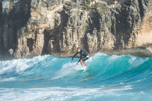 istock Solo male surfer in Hawaii dropping in 966807190