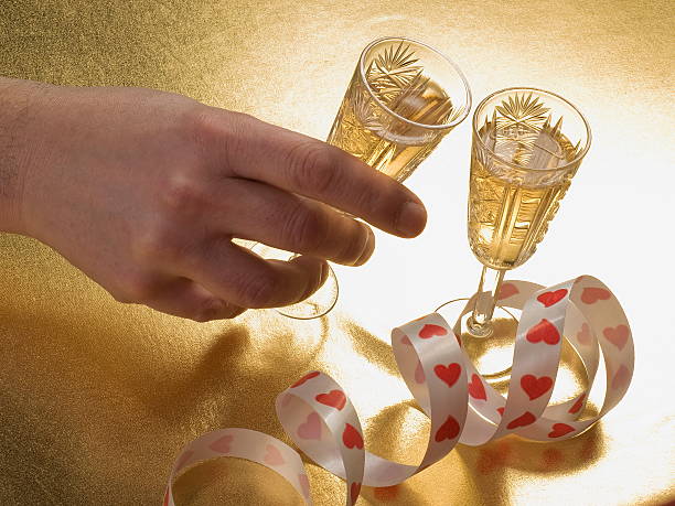 istock man's hand on a glass of wine 96681493