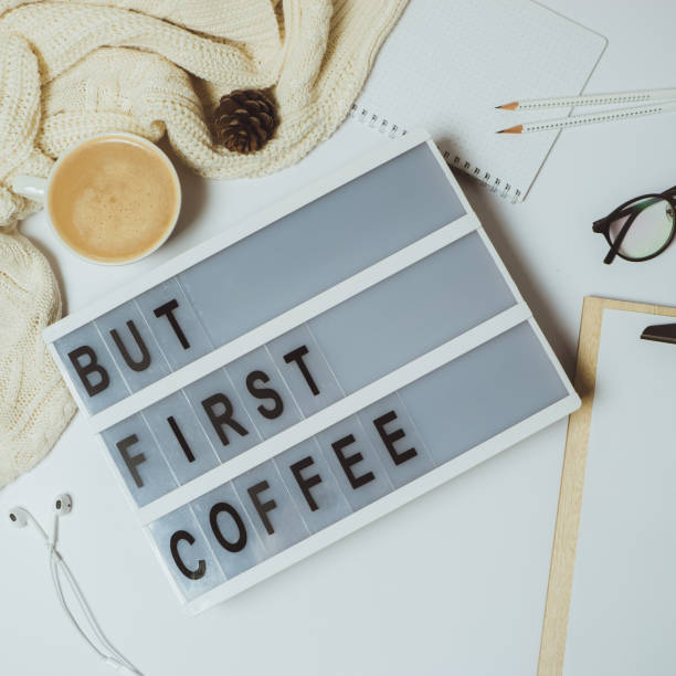 istock Creative desk But first coffee workspace with clipboard, pen, mug on white background. Flat lay, top view 966816964