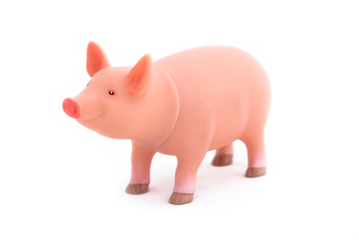 Marzipan pig on wooden background