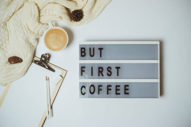 istock Creative desk But first coffee workspace with clipboard, pen, mug on white background. Flat lay, top view 966817786