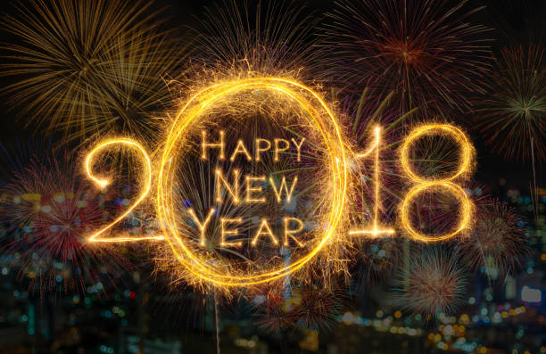 istock Happy new year 2018 written with Sparkle firework on fireworks with dark background, celebration and greeting cards concept 966817910