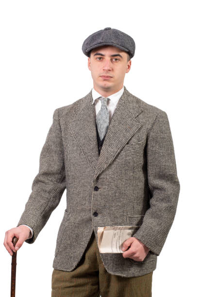 istock a young man in retro clothes with hat, 1940 style, on white 966818046