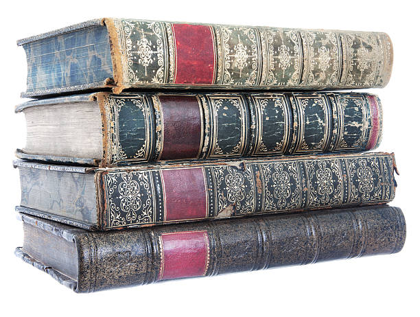 Pile of old leather bound books stock photo