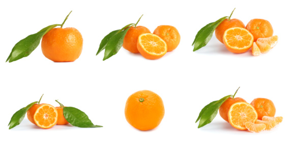 Set of orange fruits, slices and orange leaves isolated on white background. File contains clipping path.
