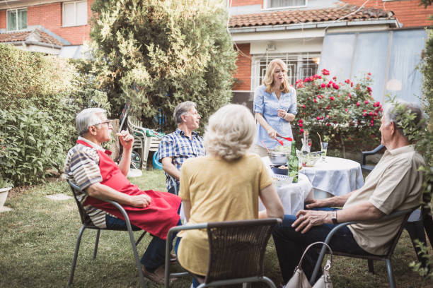 istock Senior people, friends, enjoying backyard barbecue 966828224