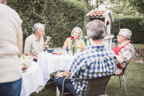 istock Senior people, friends, enjoying backyard barbecue 966828614