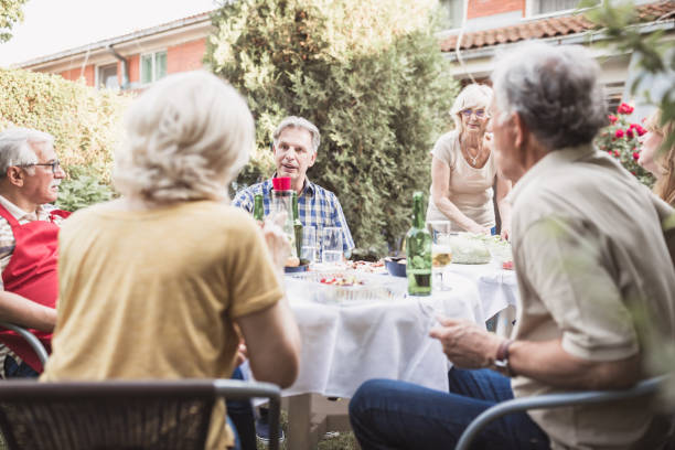 istock Senior people, friends, enjoying backyard barbecue 966830418