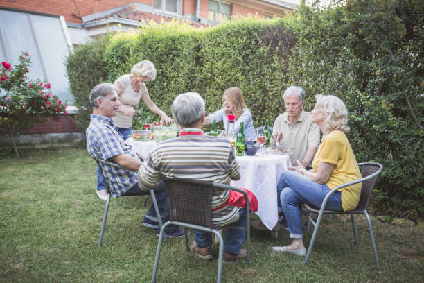 istock Senior people, friends, enjoying backyard barbecue 966830440