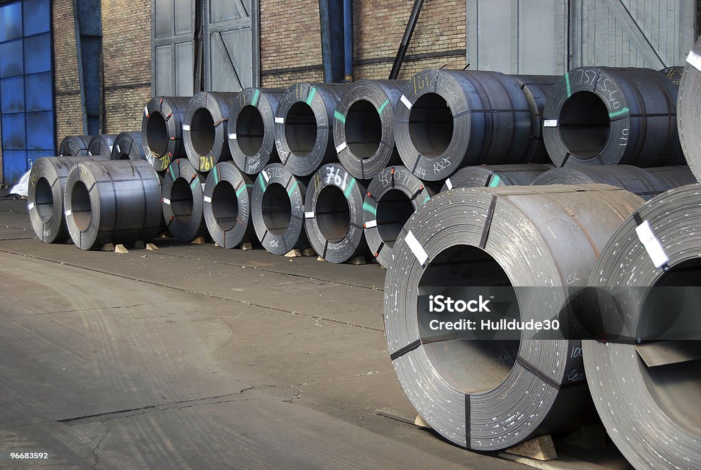 Coils of steel sheet in warehouse  Curled Up Stock Photo