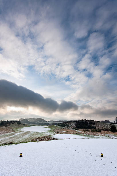 Winter landscape with big clouds in Germany Brandenburg Oderbruch.