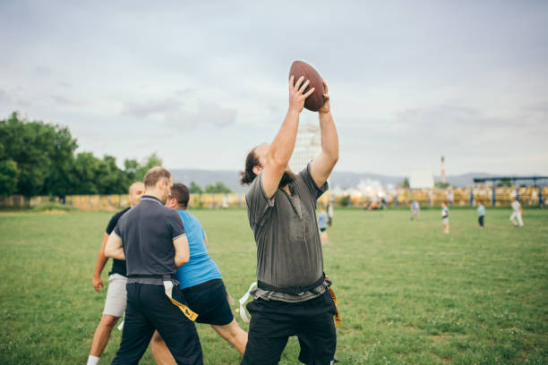 istock Amateurs playing american football 966844240