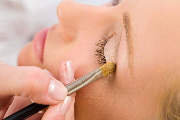 istock Beautiful Woman Having Make Up Applied by Beautician at Spa 96684653