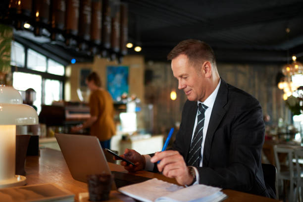 istock Businessman in coffee shop 966849498