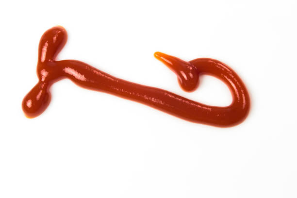 istock Tomato sauce isolated on white background. Red ketchup splashes isolated on white background, top view 966849506