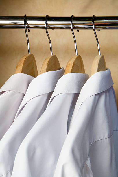 istock Four shirts hanging in the wardrobe. 96684961