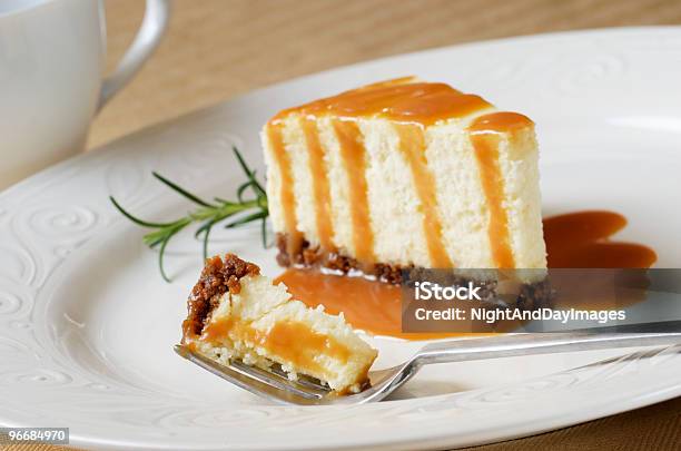 Cheesecake Slice With Caramel Sauce Bite On Fork Stock Photo - Download Image Now - Baked, Beige, Brown