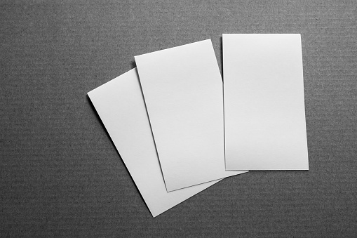 Blank portrait mock-up paper. brochure magazine isolated on gray paper , changeable background / white paper isolated on gray