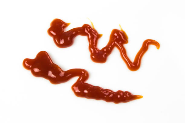istock Tomato sauce isolated on white background. Red ketchup splashes isolated on white background, top view 966855082