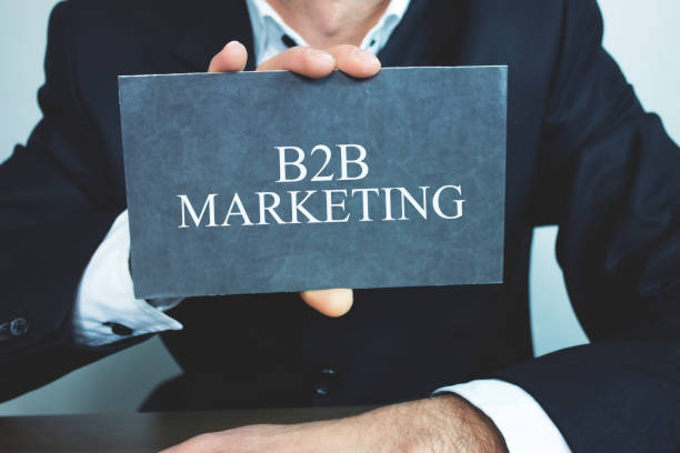 istock Businessman showing B2B Marketing word on cardboard. 966866020