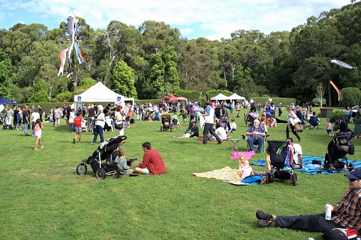 6 May 2018. People relaxing in park in Australian city of Coffs Harbour Botanic Garden. People enjoying day out at Japanese Children's Day Festival