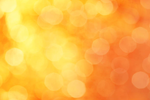 istock yellow and orange color abstract background with blurred defocus bokeh light for template 966873384