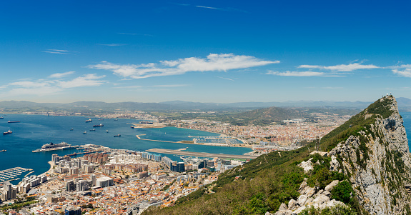 Panoramic view of Gibraltar Rock, Gibraltar town and bay. Gibraltar is British Overseas Territory in South West Europe.
