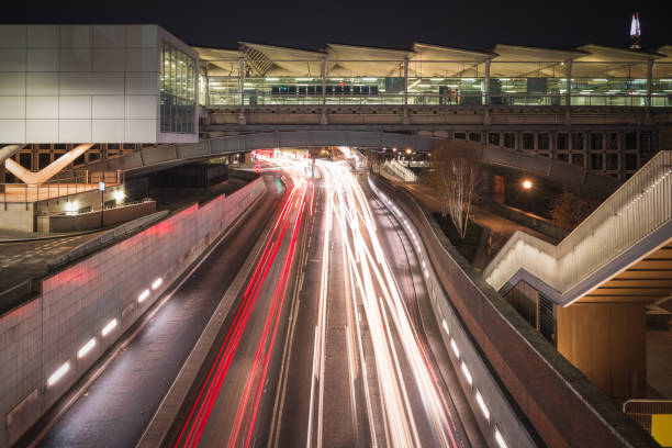Blackfriars railway bridge with traffic light trails underneath in London