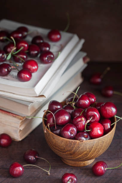istock Cherries on a  wooden table 966884746
