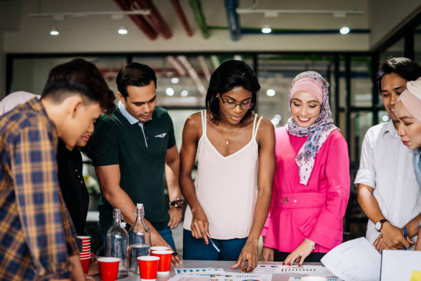 istock Group of diverse people brainstorming 966889590