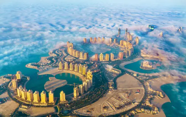 Photo of Aerial view of the Pearl-Qatar island in Doha through the morning fog - Qatar, the Persian Gulf