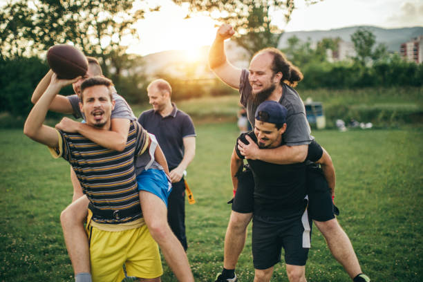 istock Amateurs playing american football 966899136