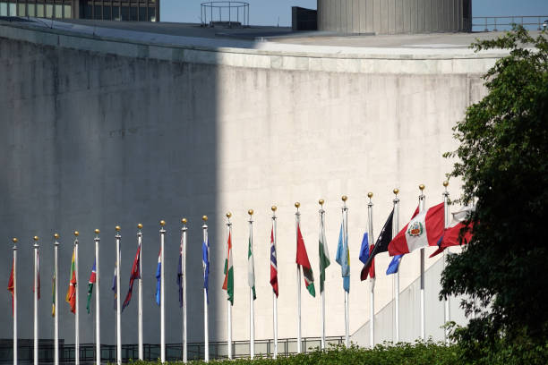 istock flags outside united nations building in new york 966905782