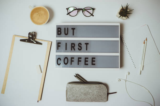 istock Creative desk But first coffee workspace with clipboard, pen, mug on white background. Flat lay, top view 966905812