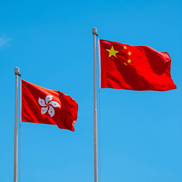 istock Hong Kong And Chinese Flag With Blue Sky 966907586