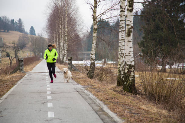 istock Woman running on road 966912926