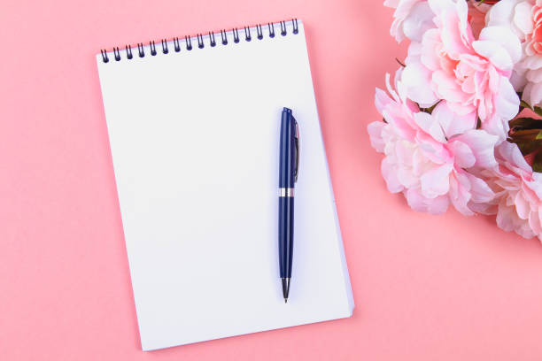 istock Empty notebook with blue pen on a pink pastel background. mock-up, frame, template. 966913972