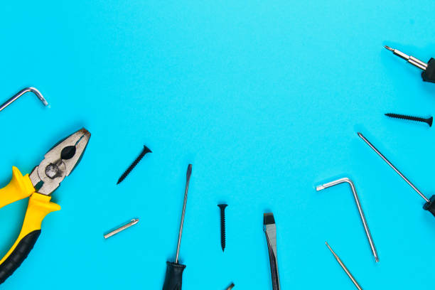 istock Set of various tools on blue wooden background. Construction and renovation concept with copy space. 966914042