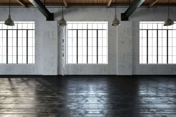 Empty loft interior with windows and black floor