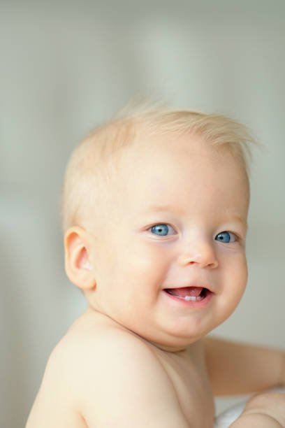 istock Baby boy with blue eyes 966921820