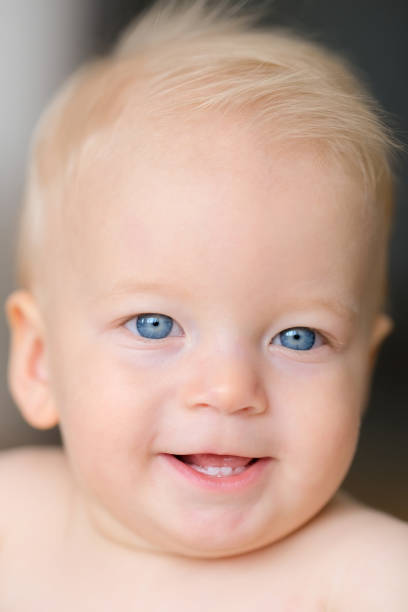 istock Baby boy with blue eyes 966921878
