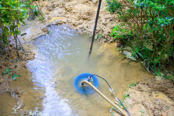 istock water flow broken pipe On the floor in garden copy space add text 966922050