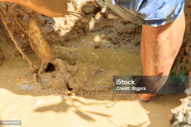 Male Plumber Are Repair Broken Pipe In Hole With Plumbing Water Flow Outdoor And Sunlight With Copy Space Add Text Stock Photo - Download Image Now