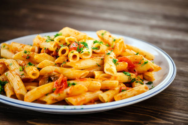 istock Penne with sauce and pork 966929462