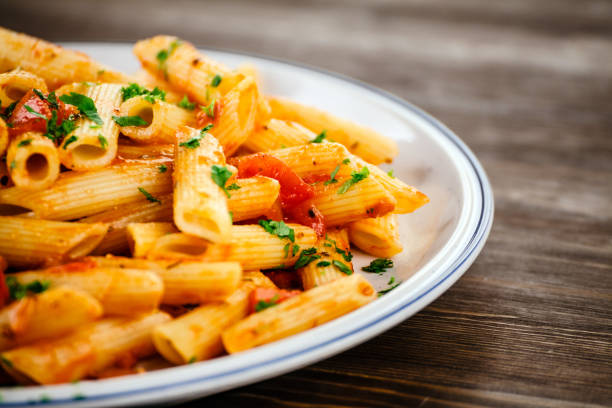 istock Penne with sauce and pork 966929504