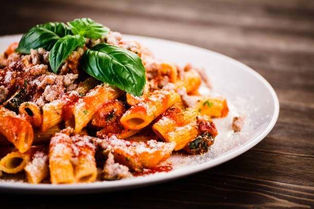 istock Penne with sauce and pork 966931940
