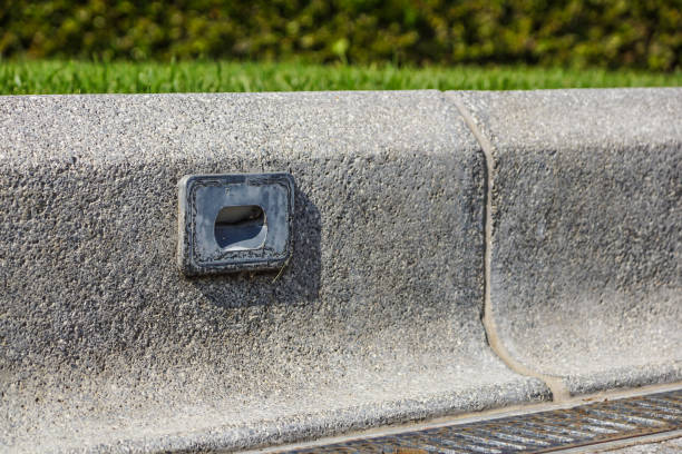 istock damage Spotlight on small wall at outdoor walkway curb road 966939668
