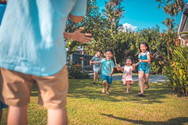 istock Kids having fun in the backyard at home 966947136