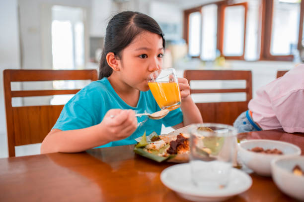 istock Girl eating breakfast 966947278